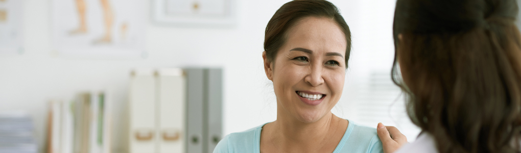 Woman talking with her provider about tubal ligation.